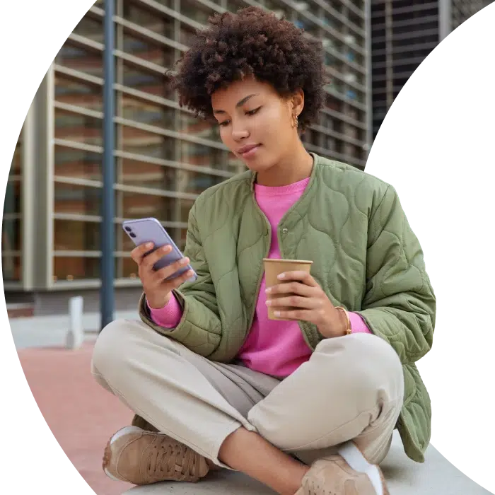 a girl using her mobile phone to apply for a second chance loan online