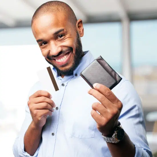 Man holding a $200 loan card and wallet, smiling and showing financial options