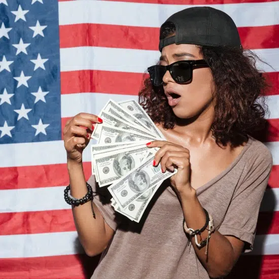 young woman with money standing over USA flag in Racine, Wi